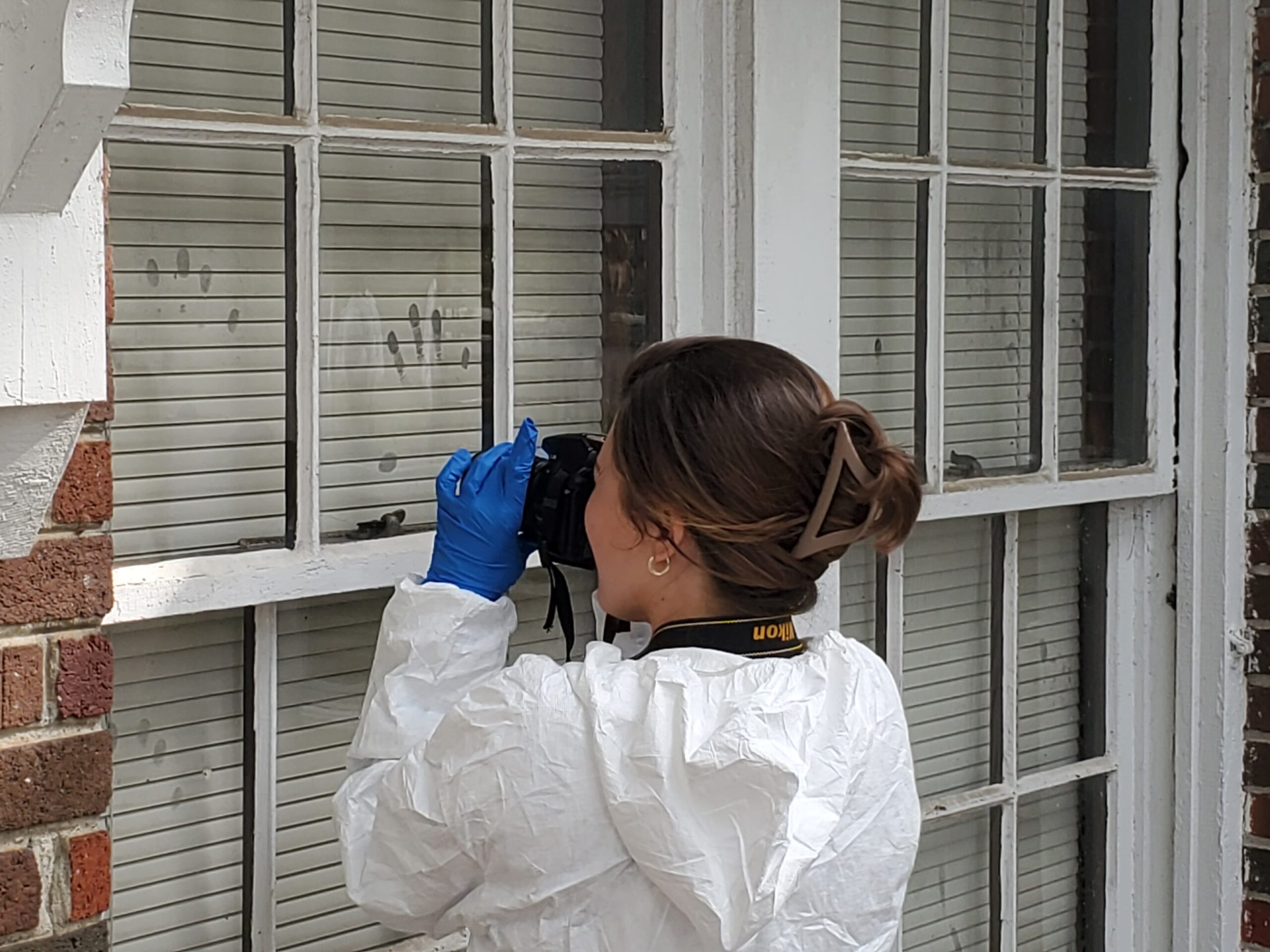 A criminal justice student learning how to investigate a crime scene.